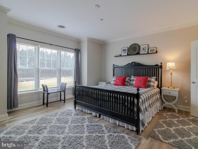 33565 Windswept Dr Unit 10201, Millsboro, DE 19966 - bedroom featuring visible vents, baseboards, wood finished floors, and ornamental molding