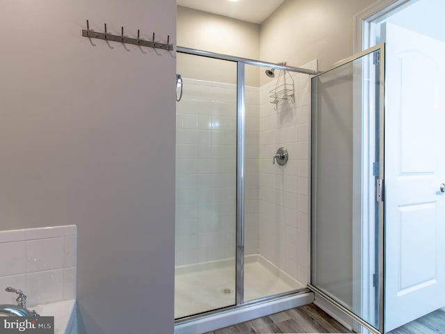 33565 Windswept Dr Unit 10201, Millsboro, DE 19966 - bathroom featuring wood finished floors and a shower stall