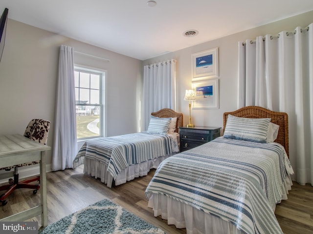 33565 Windswept Dr Unit 10201, Millsboro, DE 19966 - bedroom featuring visible vents and wood finished floors