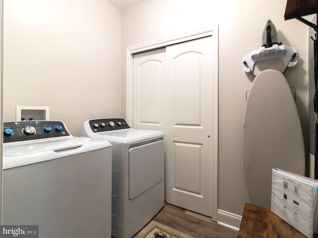 33565 Windswept Dr Unit 10201, Millsboro, DE 19966 - laundry area featuring laundry area, wood finished floors, and separate washer and dryer