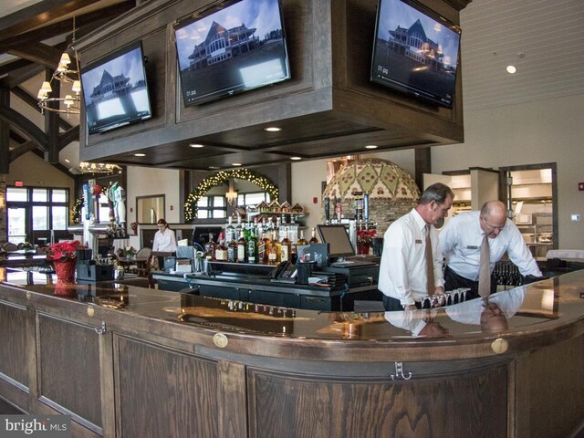 33565 Windswept Dr Unit 10201, Millsboro, DE 19966 - bar featuring a bar and a notable chandelier