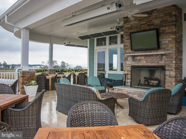 33565 Windswept Dr Unit 10201, Millsboro, DE 19966 - exterior space with a patio area, outdoor dining space, and an outdoor living space with a fireplace