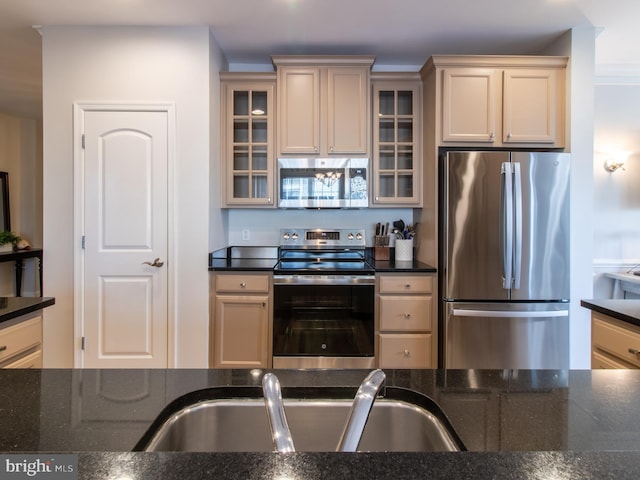 33565 Windswept Dr Unit 10201, Millsboro, DE 19966 - kitchen featuring a sink, dark stone counters, glass insert cabinets, and stainless steel appliances