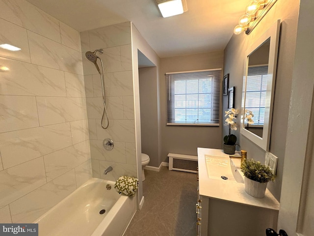 bathroom with baseboards, toilet, vanity, and bathtub / shower combination