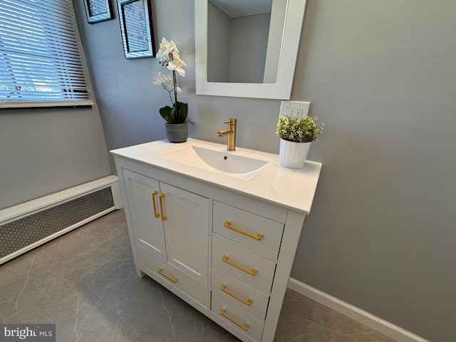 bathroom with baseboards and vanity