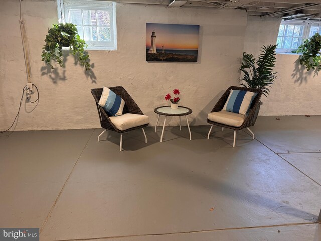 sitting room featuring finished concrete floors