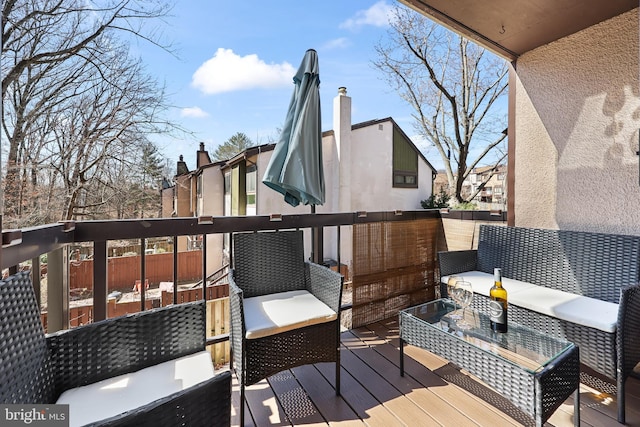 wooden terrace featuring outdoor lounge area