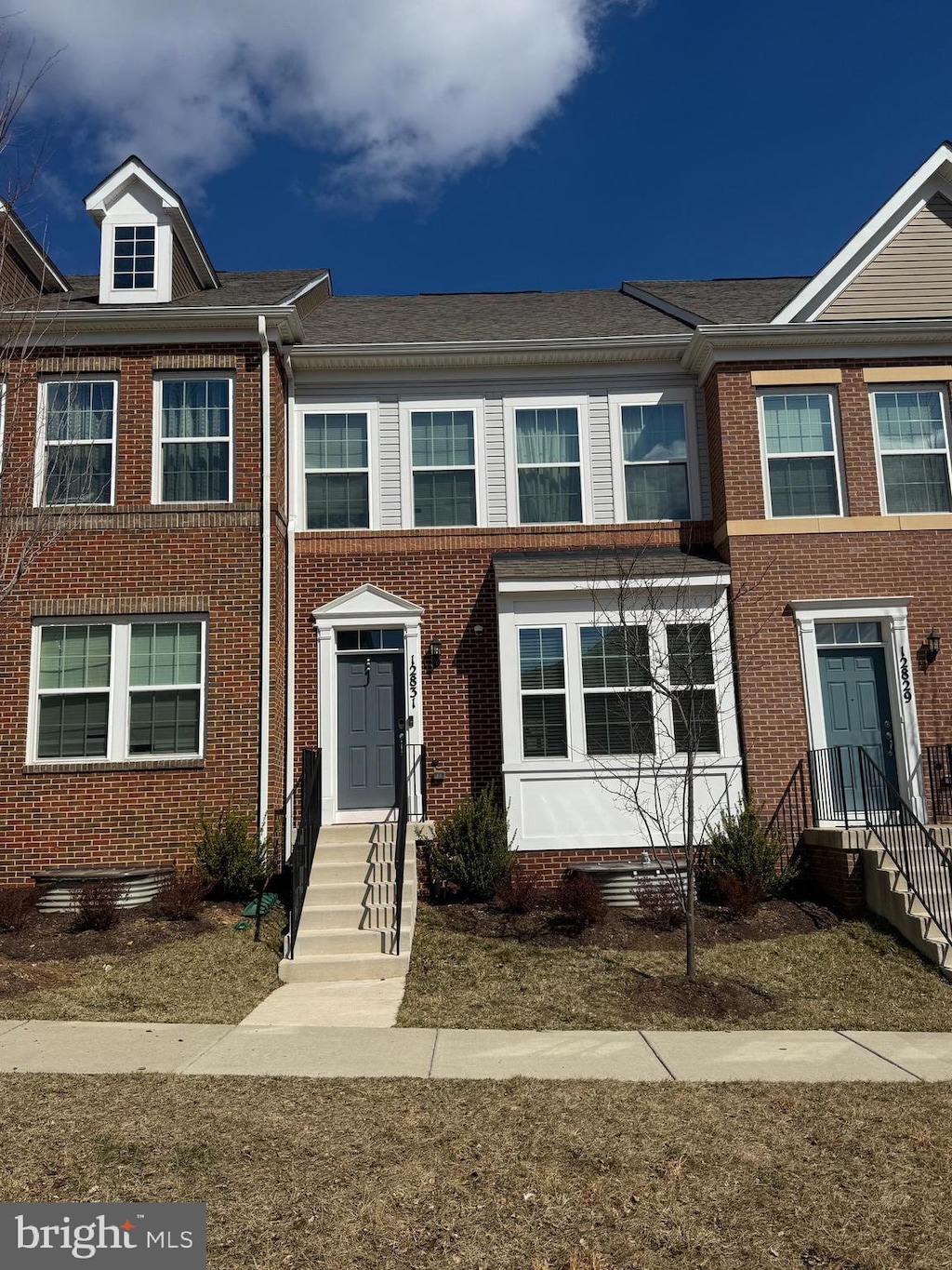 multi unit property featuring brick siding