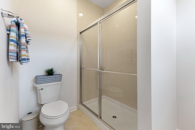 12831 Clarksburg Square Rd, Clarksburg, MD 20871 - bathroom with toilet, tile patterned floors, and tiled shower