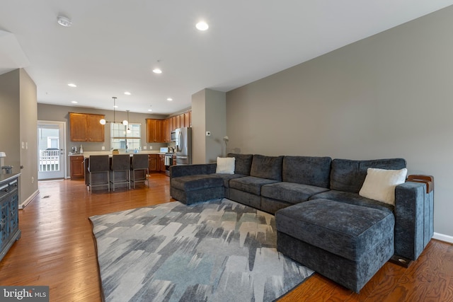 12831 Clarksburg Square Rd, Clarksburg, MD 20871 - living room featuring baseboards, recessed lighting, and wood finished floors