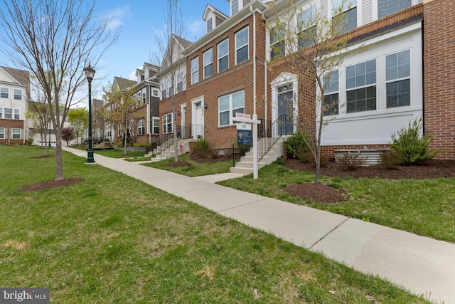 12831 Clarksburg Square Rd, Clarksburg, MD 20871 - multi unit property featuring a residential view, brick siding, and a front lawn
