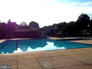 community pool with a patio