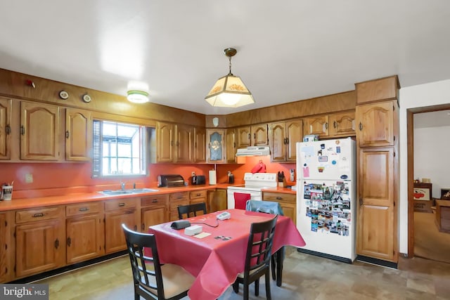 kitchen with white appliances, a sink, light countertops, exhaust hood, and brown cabinets