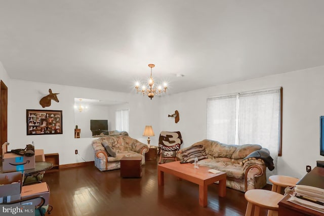 living room featuring an inviting chandelier and hardwood / wood-style flooring