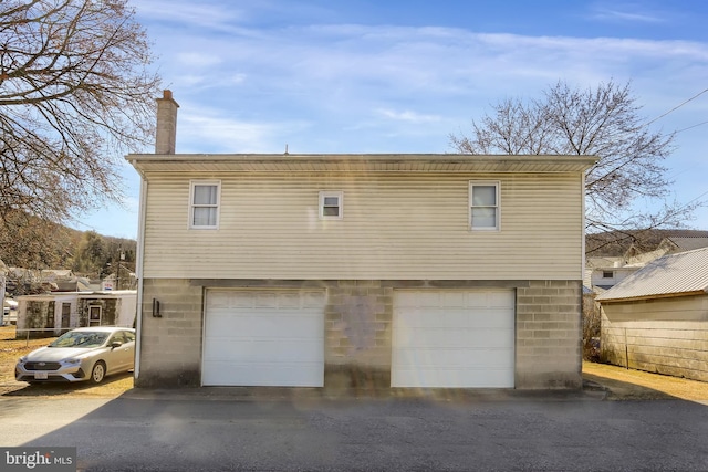 exterior space with a garage