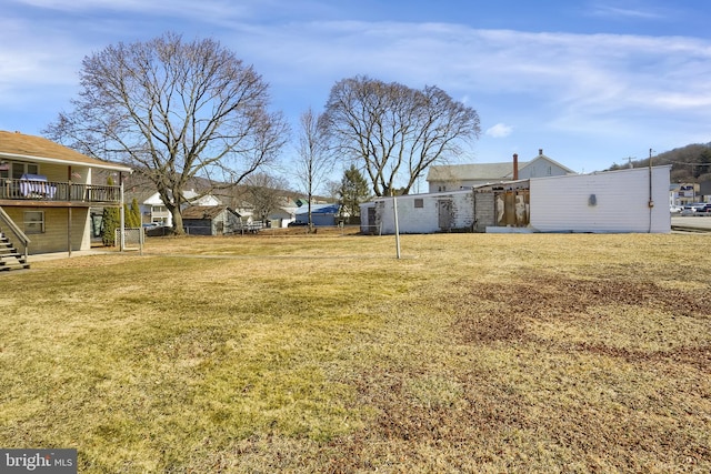 view of yard with stairway and fence