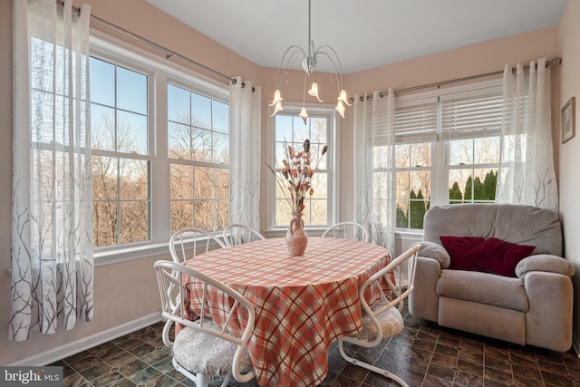 dining space featuring baseboards