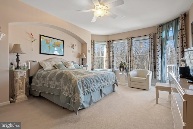 bedroom featuring baseboards, a ceiling fan, and carpet