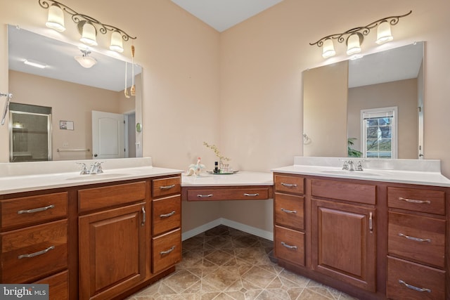 bathroom with a shower stall, two vanities, tile patterned floors, and a sink