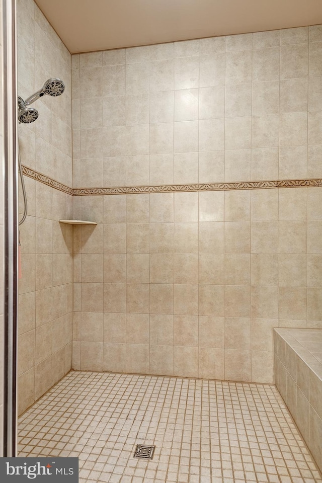 bathroom with tiled shower