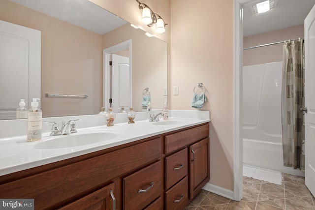 full bathroom featuring double vanity, tile patterned floors, a shower with shower curtain, and a sink