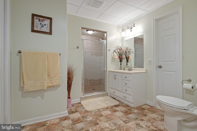 full bath with visible vents, a stall shower, vanity, and baseboards