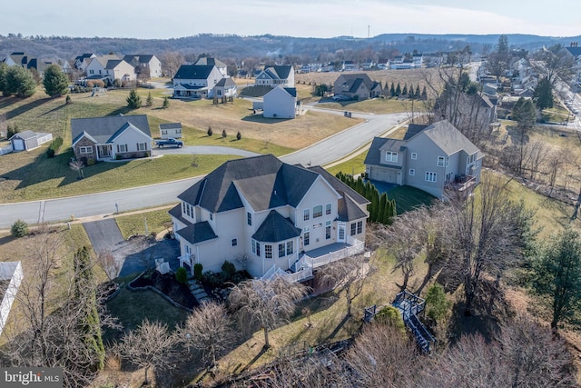 birds eye view of property with a residential view