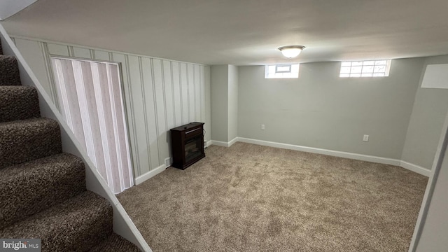 basement with stairs, baseboards, and carpet floors