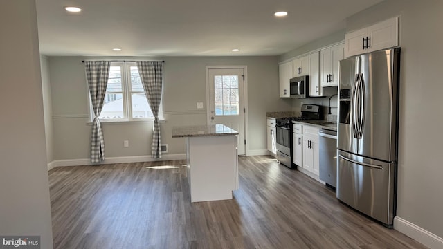 kitchen featuring dark wood-style floors, white cabinets, and stainless steel appliances