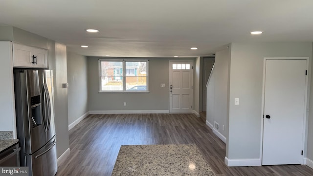 foyer entrance featuring recessed lighting, visible vents, baseboards, and wood finished floors