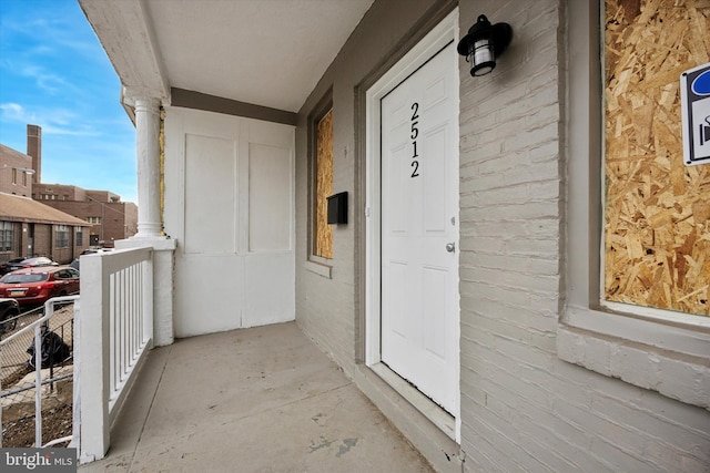 entrance to property with a balcony