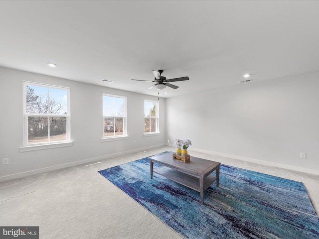 sitting room featuring visible vents, baseboards, and carpet