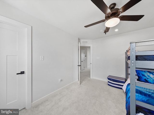 bedroom with visible vents, baseboards, carpet, and a ceiling fan