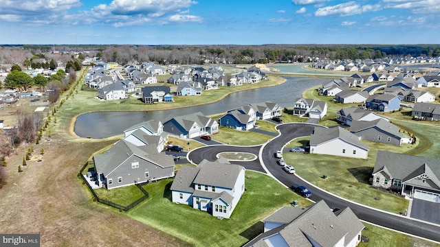 drone / aerial view with a residential view and a water view