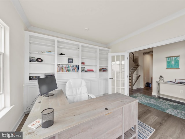 home office featuring ornamental molding and wood finished floors