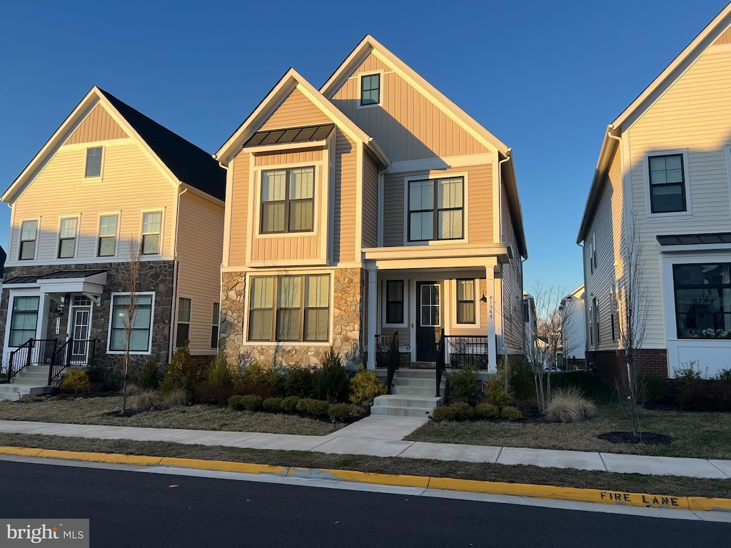 view of front of property with board and batten siding and stone siding