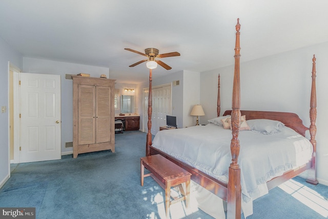 bedroom featuring carpet floors, baseboards, a ceiling fan, and ensuite bathroom