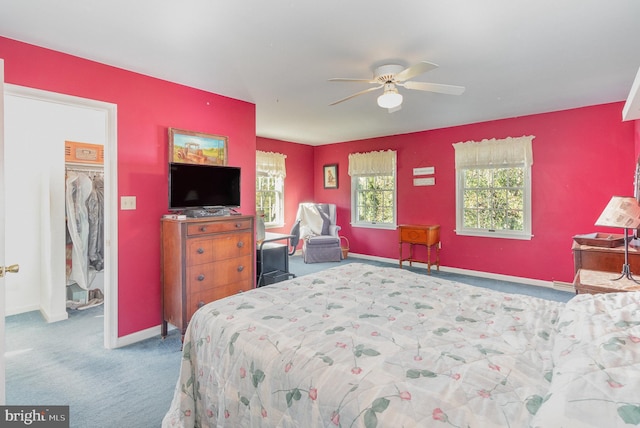 bedroom with carpet floors, ceiling fan, and baseboards