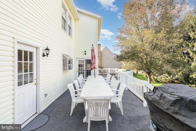 view of patio / terrace featuring outdoor dining space and grilling area