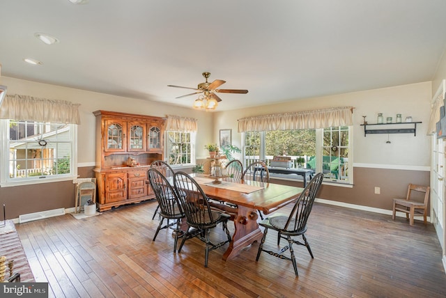 dining space with light wood-style flooring, visible vents, and baseboards