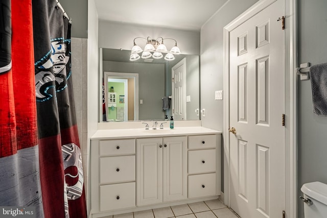 full bath featuring a shower with shower curtain, toilet, vanity, and tile patterned flooring