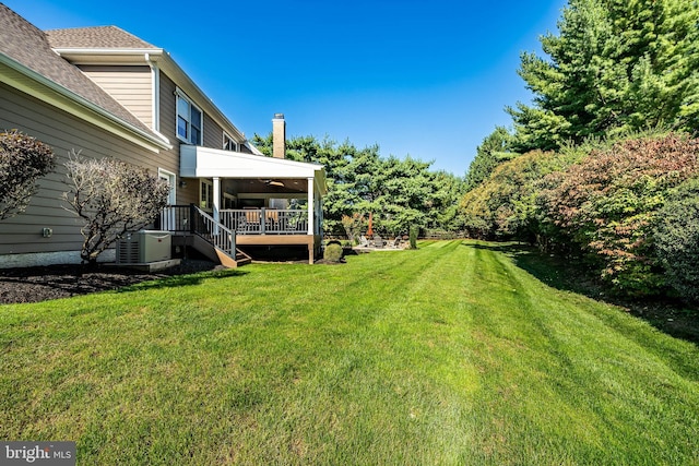 view of yard featuring stairway, cooling unit, and a wooden deck