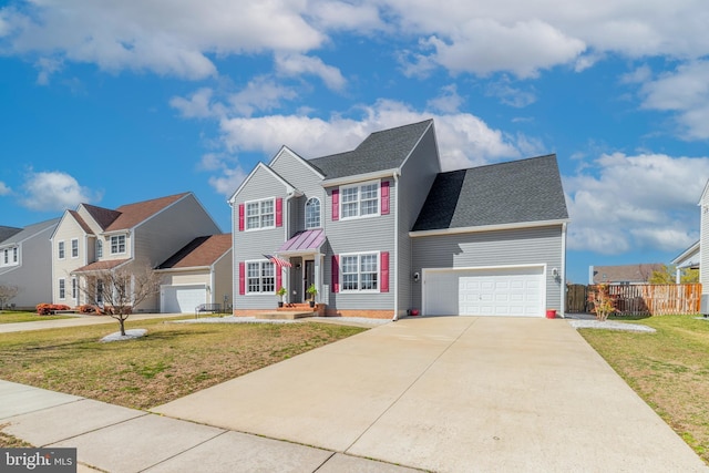 view of front of house featuring fence, a residential view, a front yard, a garage, and driveway