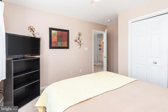 carpeted bedroom with a closet