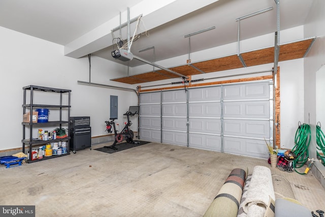 garage with electric panel and a garage door opener