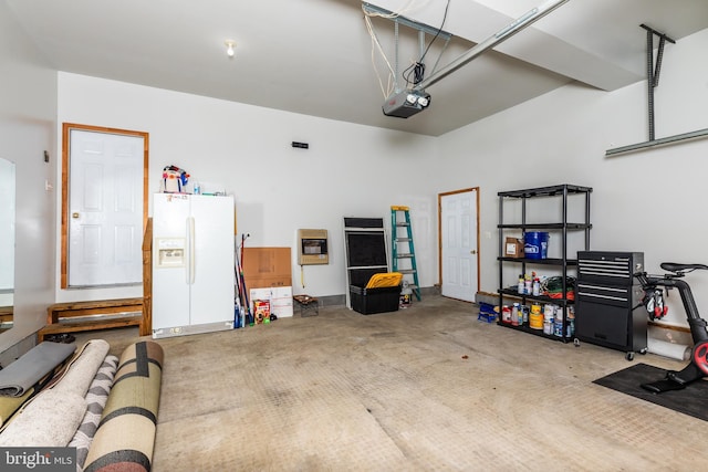 garage with heating unit, a garage door opener, and white fridge with ice dispenser