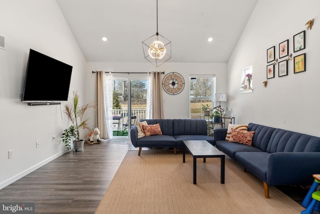 living area featuring recessed lighting, baseboards, high vaulted ceiling, and wood finished floors