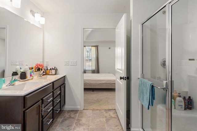 bathroom featuring ensuite bath, double vanity, a shower stall, and a sink