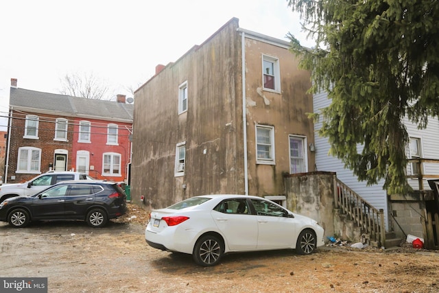 view of side of property featuring stucco siding