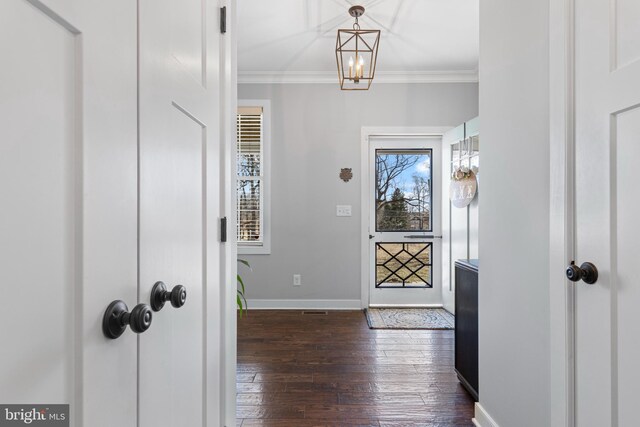 631 Monument Ave, Malvern, PA 19355 - foyer featuring baseboards, dark wood-type flooring, and ornamental molding